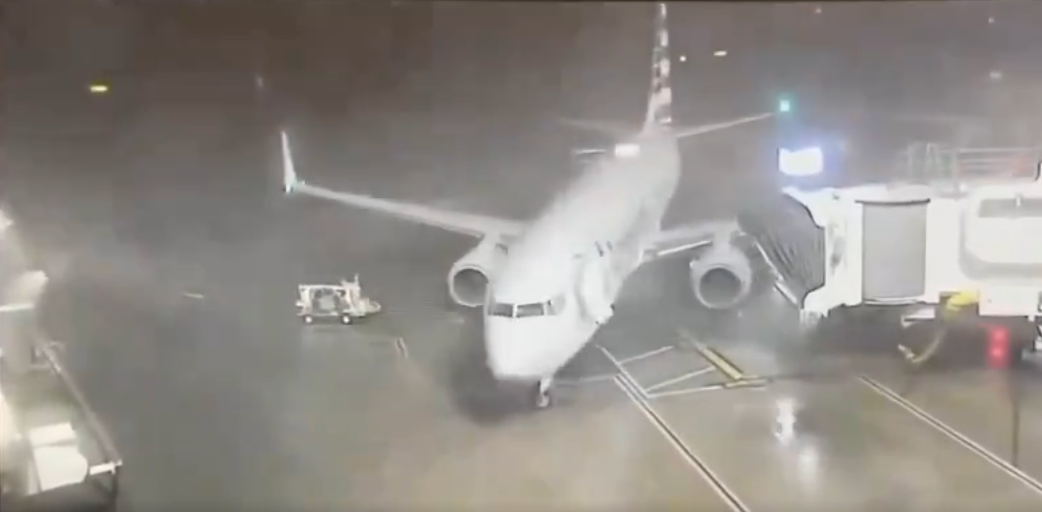 Heavy winds at Dallas-Forth Worth International Airport blow an American Airlines aircraft, pictured, away from its gate on Tuesday morning